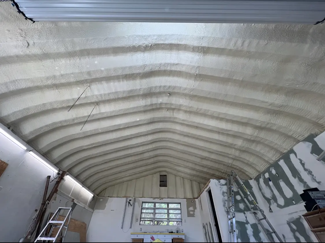 Spray polyurethane foam applied to the underside of a metal roof deck in Wayne
